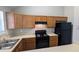 Functional kitchen featuring ample cabinet space, an electric stove, and a refrigerator at 831 Stonebrook Dr, Lithonia, GA 30058