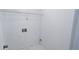 Functional laundry room with washer/dryer hookups, a shelf, and white walls at 831 Stonebrook Dr, Lithonia, GA 30058