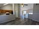 Spacious living space featuring wood floors, high ceilings, and an adjacent kitchen at 831 Stonebrook Dr, Lithonia, GA 30058