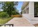 Spacious back porch with black iron railing and backyard view at 1083 Amelia Sw Dr, Marietta, GA 30060