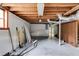 Basement featuring exposed beams, window, concrete floor and storage space at 1083 Amelia Sw Dr, Marietta, GA 30060