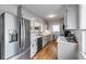 Updated kitchen with stainless steel appliances, white countertops, and a modern backsplash at 1083 Amelia Sw Dr, Marietta, GA 30060