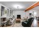 Cozy living room with a plush sofa, a modern ceiling fan, and hardwood floors at 1083 Amelia Sw Dr, Marietta, GA 30060