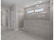 Modern bathroom featuring an expansive tile shower with glass partition and updated fixtures at 1975 Sage Lake Bend Sw, Marietta, GA 30064