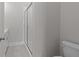 Modern bathroom featuring a tiled shower with a glass door, neutral walls, and modern fixtures at 1975 Sage Lake Bend Sw, Marietta, GA 30064