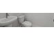 Powder room featuring a toilet and pedestal sink with a faucet at 1975 Sage Lake Bend Sw, Marietta, GA 30064