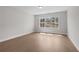 Bright bedroom featuring beautiful wood floors and a large window offering a scenic outdoor view at 1975 Sage Lake Bend Sw, Marietta, GA 30064