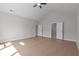 Spacious bedroom with vaulted ceiling, ceiling fan, and two doors leading to other rooms at 1975 Sage Lake Bend Sw, Marietta, GA 30064