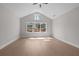 Sun-filled bedroom with hardwood floors, a vaulted ceiling, and a large window offering natural light at 1975 Sage Lake Bend Sw, Marietta, GA 30064