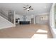 Open concept living room with kitchen, dining, living areas, hardwood floors, and a staircase at 1975 Sage Lake Bend Sw, Marietta, GA 30064