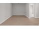 Neutral room featuring light hardwood floors and white trim for a clean and modern aesthetic at 1975 Sage Lake Bend Sw, Marietta, GA 30064