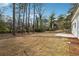 Large, grassy backyard offers space for outdoor activities and potential landscaping ideas at 7180 Whitfield Dr, Riverdale, GA 30296