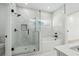 Bathroom features a shower with marble tile, glass door, and built in soaking tub at 7180 Whitfield Dr, Riverdale, GA 30296