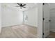Spacious bedroom with wood-look floors, ceiling fan, and walk-in closet enhances this home at 7180 Whitfield Dr, Riverdale, GA 30296