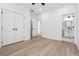 Large bedroom features wood-look floors, a walk-in closet, and an attached bathroom at 7180 Whitfield Dr, Riverdale, GA 30296