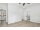 Bright bedroom with wood floors, base molding, and access to the bathroom at 7180 Whitfield Dr, Riverdale, GA 30296