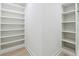 Walk in closet with multiple built-in shelves for storage at 7180 Whitfield Dr, Riverdale, GA 30296