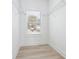 Walk in closet with multiple wire racks for storage and a window that gives a view to the outside at 7180 Whitfield Dr, Riverdale, GA 30296
