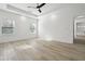 Large bedroom with tray ceiling, fan, recessed lights and vinyl floors at 7180 Whitfield Dr, Riverdale, GA 30296