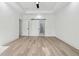 Spacious bedroom with tray ceiling, recessed lighting, and vinyl floors at 7180 Whitfield Dr, Riverdale, GA 30296