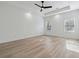 Spacious main bedroom featuring tray ceiling, ceiling fan, recessed lights and vinyl floors at 7180 Whitfield Dr, Riverdale, GA 30296