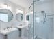 Modern bathroom featuring dual sinks, updated fixtures, and a glass-enclosed shower at 247 Heaton Park Dr, Atlanta, GA 30030