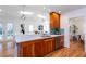 Bright kitchen with hardwood floors, warm wood cabinets, stainless steel appliances, and a skylight at 247 Heaton Park Dr, Atlanta, GA 30030