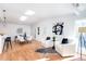 Bright and airy living room featuring hardwood floors, skylights, and stylish modern decor at 247 Heaton Park Dr, Atlanta, GA 30030