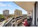 Condo balcony provides views of lush greenery and distant buildings at 2660 Peachtree Nw Rd # 11G, Atlanta, GA 30305