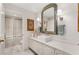 Bright bathroom with a modern sink, white cabinets, and a tiled shower with glass doors at 2660 Peachtree Nw Rd # 11G, Atlanta, GA 30305