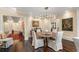 Inviting dining area featuring a modern chandelier, neutral walls, and hardwood flooring at 2660 Peachtree Nw Rd # 11G, Atlanta, GA 30305