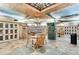 Charming wine cellar with unique decor, tiled floors, and seating areas at 2660 Peachtree Nw Rd # 11G, Atlanta, GA 30305