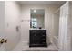 Bathroom featuring a vanity with a dark cabinet, updated hardware, and tub with shower at 285 Glen Lake Dr, Sandy Springs, GA 30327