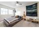 Bedroom features neutral paint, carpet, and a modern platform bed with movie-themed wall art at 285 Glen Lake Dr, Sandy Springs, GA 30327