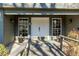 Welcoming front entrance featuring a charming walkway, double doors, and decorative plants at 285 Glen Lake Dr, Sandy Springs, GA 30327