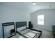 Neutral bedroom with plush carpet and an assembled bed frame at 301 Eleanora Xing, Loganville, GA 30052