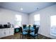 Bright dining area with large windows and stylish furnishings at 301 Eleanora Xing, Loganville, GA 30052