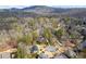 Aerial view showcasing a neighborhood with mature trees and landscaping at 4165 Liberty Trce, Marietta, GA 30066