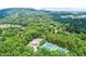 Aerial view of the community showcasing tennis courts and lush greenery at 4165 Liberty Trce, Marietta, GA 30066