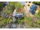 Aerial view of a home showing the mature landscaping, driveway, and unique roof line at 4165 Liberty Trce, Marietta, GA 30066