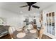 Bright breakfast nook with a wooden table, white trim, and open view to the kitchen at 4165 Liberty Trce, Marietta, GA 30066