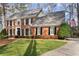 Beautiful brick home with black shutters, mature landscaping and a well maintained lawn at 4165 Liberty Trce, Marietta, GA 30066