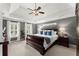 Serene main bedroom with tray ceiling, neutral paint, and ample natural light at 4165 Liberty Trce, Marietta, GA 30066