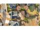 Aerial view of the property showcasing its lush landscaping and proximity to neighborhood streets at 586 Shoal Mill Sw Rd, Smyrna, GA 30082