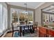 Bright breakfast nook with backyard views through large windows for a serene dining experience at 586 Shoal Mill Sw Rd, Smyrna, GA 30082