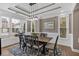 Elegant dining room with decorative trim, stylish lighting, and large windows at 586 Shoal Mill Sw Rd, Smyrna, GA 30082