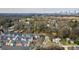 Aerial view of colorful townhouses in a vibrant neighborhood, near tree-lined streets and city views at 166 Color Cir, Atlanta, GA 30317