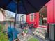 Entertaining backyard with dining area, grill, and an outdoor view to the kitchen at 166 Color Cir, Atlanta, GA 30317