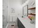 Modern bathroom with double sinks, a glass-enclosed shower, and stylish vanity at 166 Color Cir, Atlanta, GA 30317