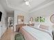 A stylish bedroom with modern decor, light wood floors, and a comfortable king-size bed at 166 Color Cir, Atlanta, GA 30317